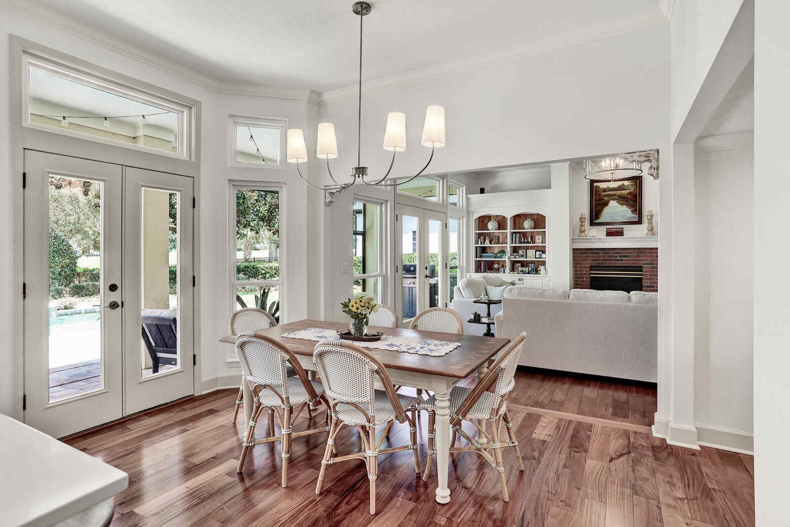 bright transitional kitchen dining area living room fireplace