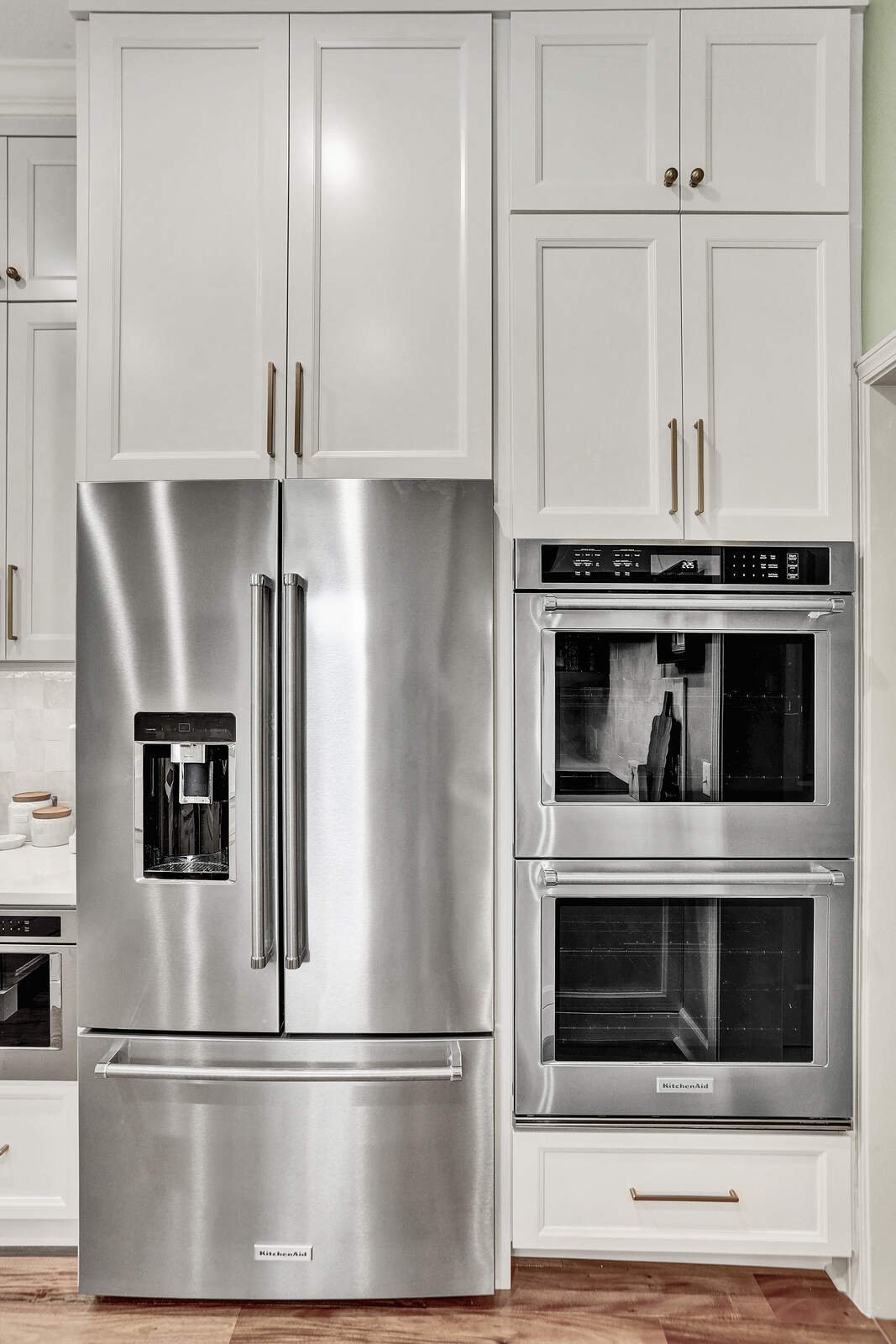 bright transitional kitchen refrigerator wall ovens