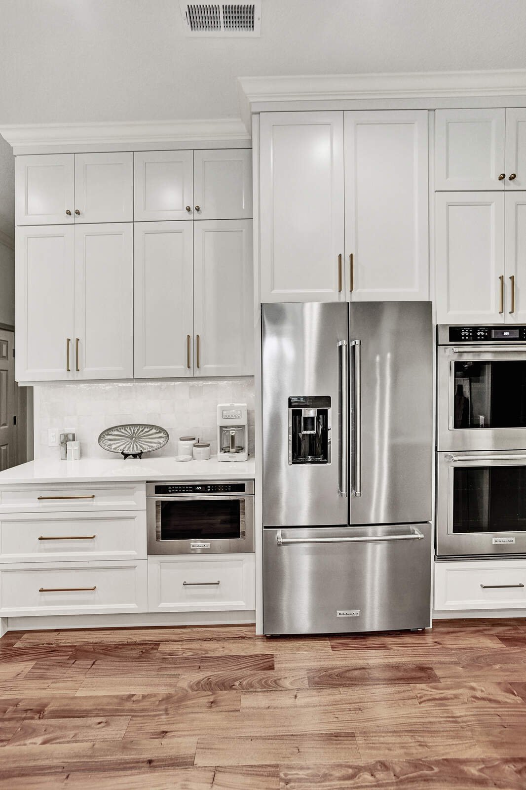 bright transitional kitchen stainless fridge double oven