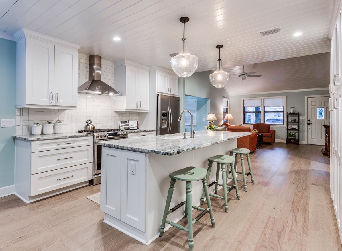 modern coastal renovation with white cabinets and open concept design