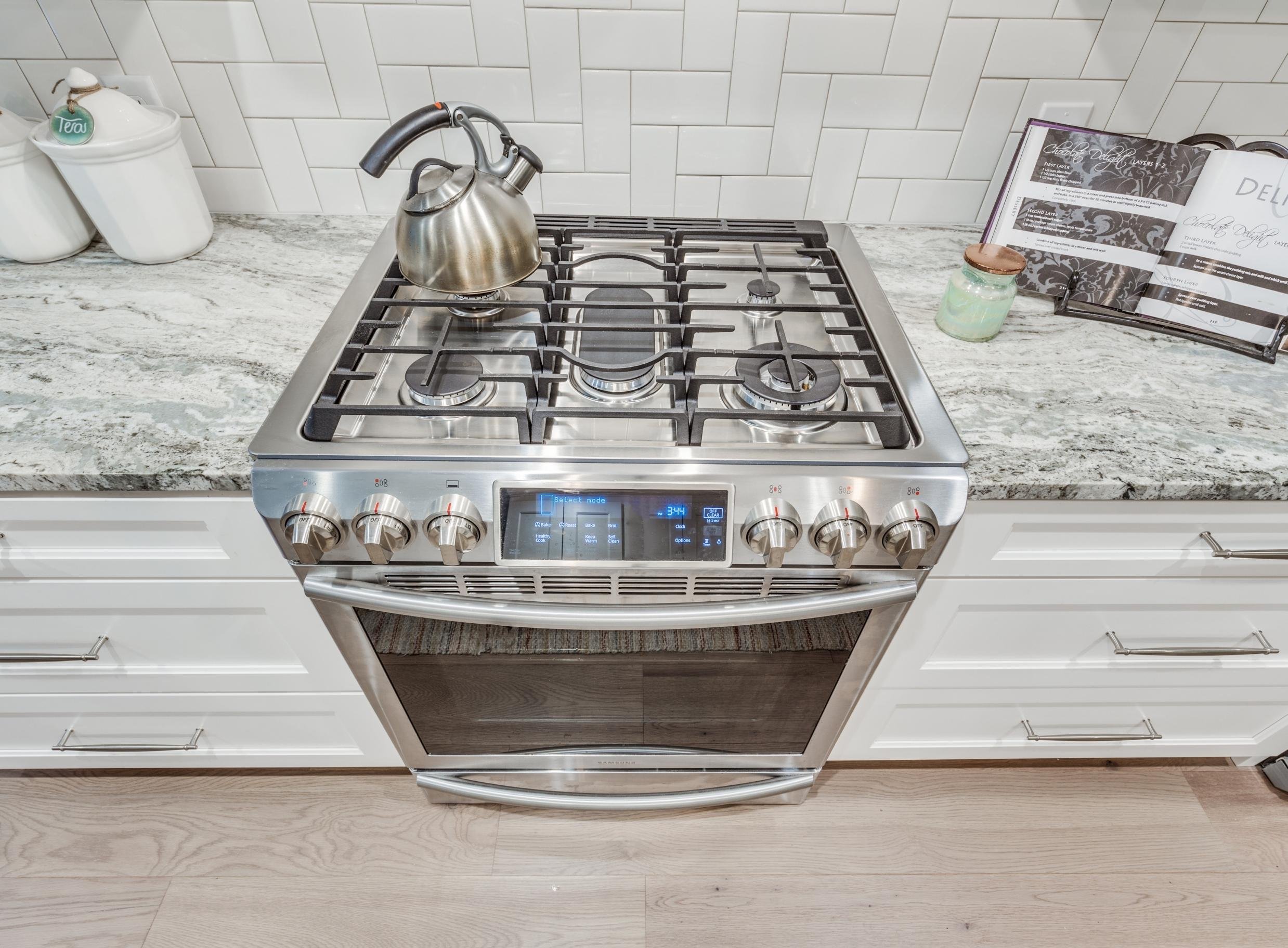 stainless steel oven and gas stovetop in an atlantic beach kitchen remodel