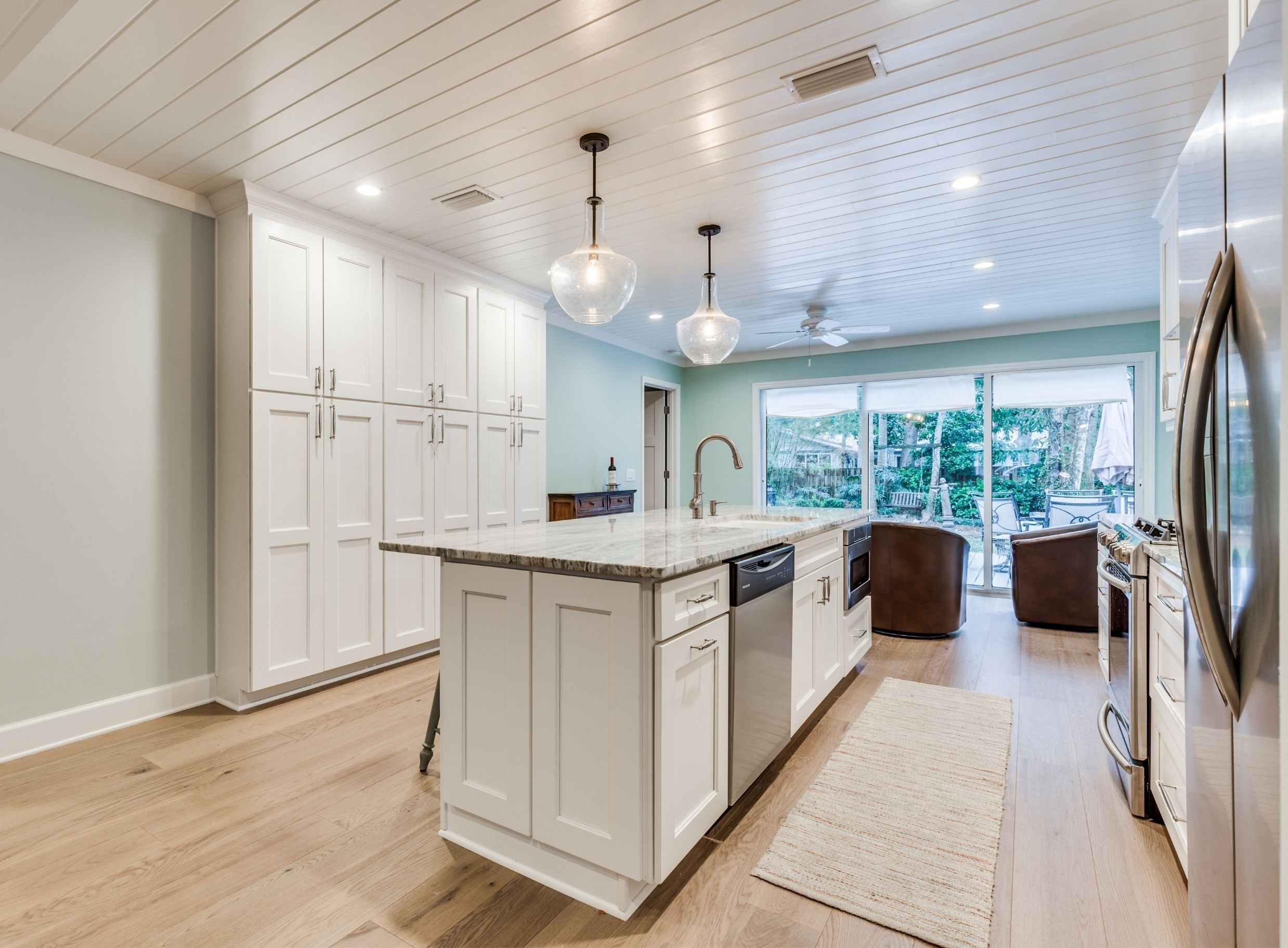 white and turquoise kitchen design in an atlantic beach remodel