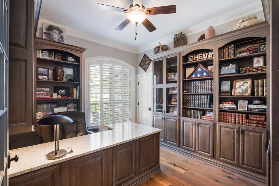 Rich wood-paneled office space with display shelving in BeeTree Homes project in Jacksonville, FL