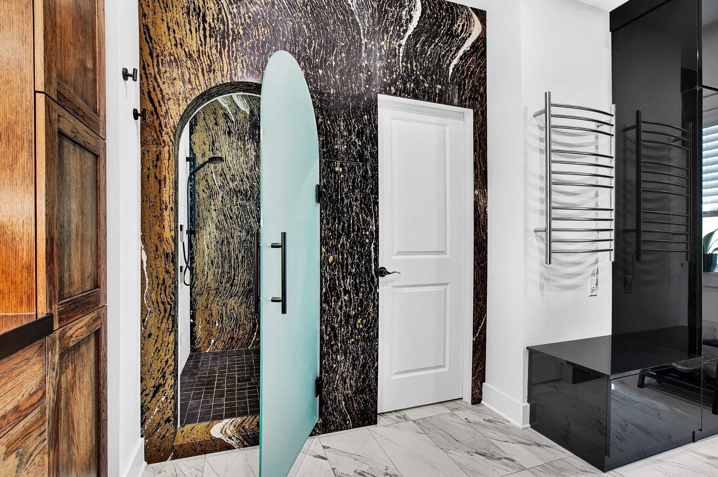 master bathroom renovation with towel warmer and dark, dramatic aesthetic