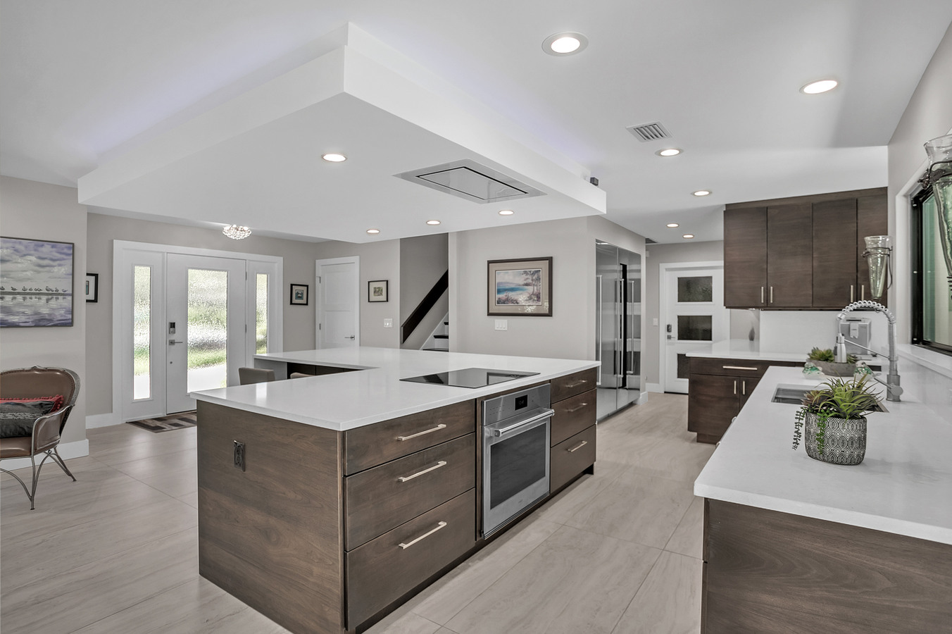 Elegant open-concept kitchen and front entry in BeeTree Homes custom home in Jacksonville, FL