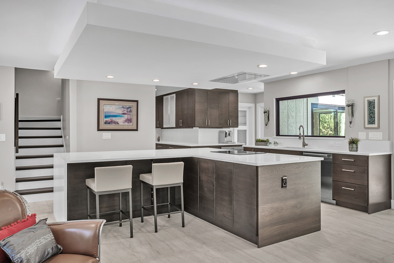 Kitchen island with breakfast bar in a BeeTree Homes custom home in Jacksonville