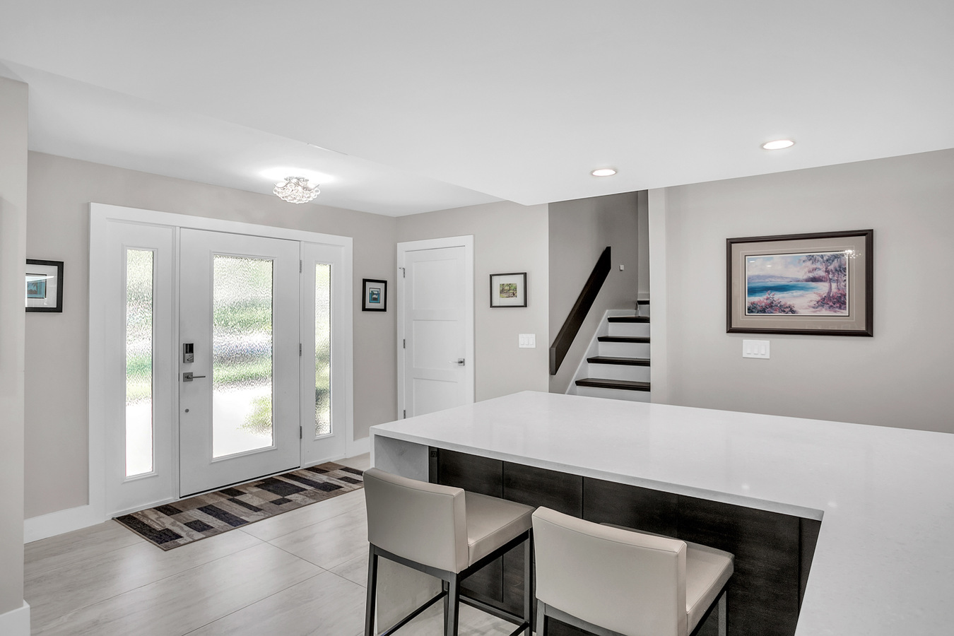 Light-filled entryway and breakfast bar in BeeTree Homes custom home in Jacksonville