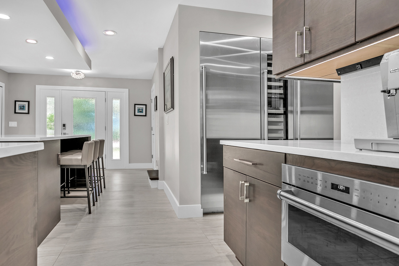 Stainless steel fridge and sleek cabinetry in BeeTree Homes Jacksonville kitchen remodel