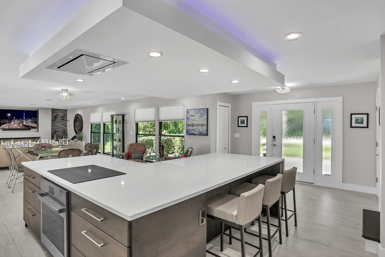 White quartz countertops and pendant ceiling lighting in Jacksonville custom home by BeeTree Homes