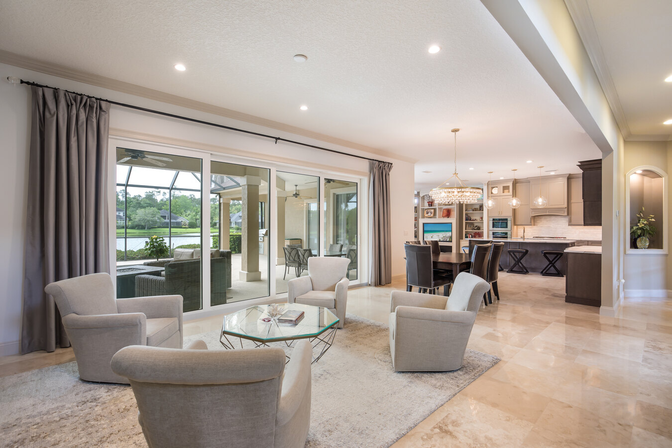 Custom home design in Avondale, FL by BeeTree Homes with contemporary furnishings and lake backdrop