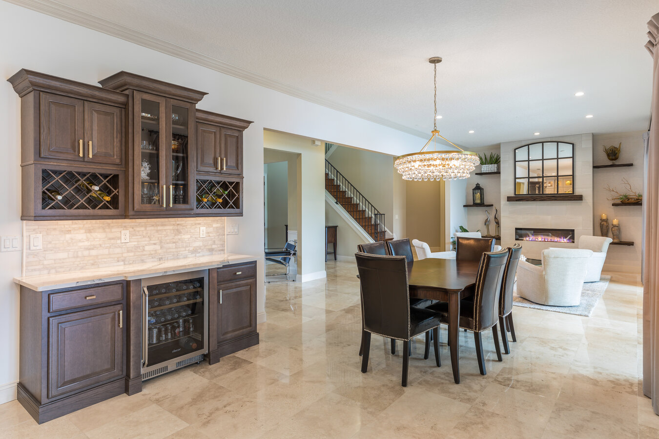 Custom wine bar and dining space by BeeTree Homes in Ponte Vedra Beach, FL with crystal chandelier