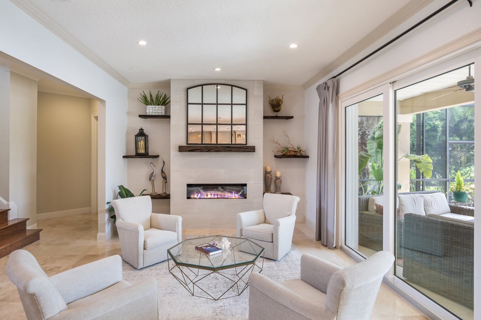 Elegant home seating space in Ponte Vedra Beach, FL by BeeTree Homes with outdoor views