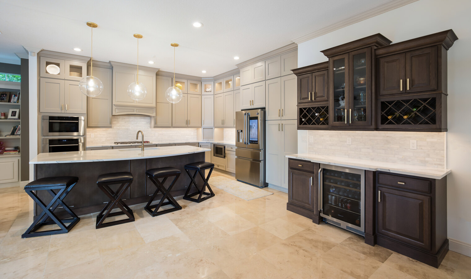 Spacious custom kitchen by BeeTree Homes in Queens Harbour, FL, with a large marble island and wine storage
