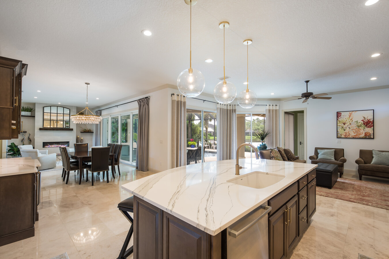 Stylish kitchen remodel in Atlantic Beach, FL by BeeTree Homes featuring bright open layout and poolside access