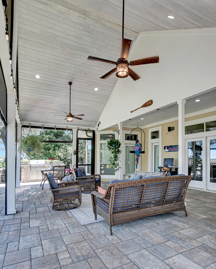 High ceiling screened patio with outdoor fans in BeeTree Homes Jacksonville custom home