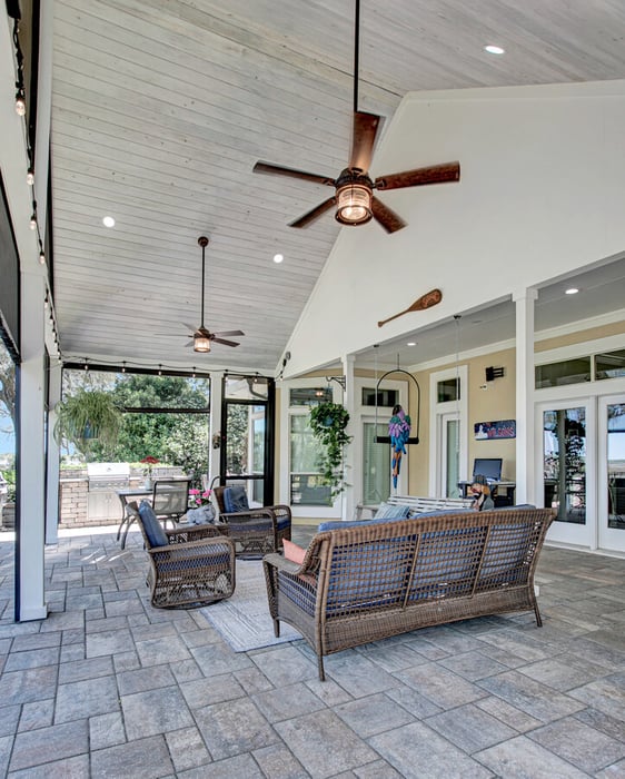 High ceiling screened patio with outdoor fans in BeeTree Homes Jacksonville custom home