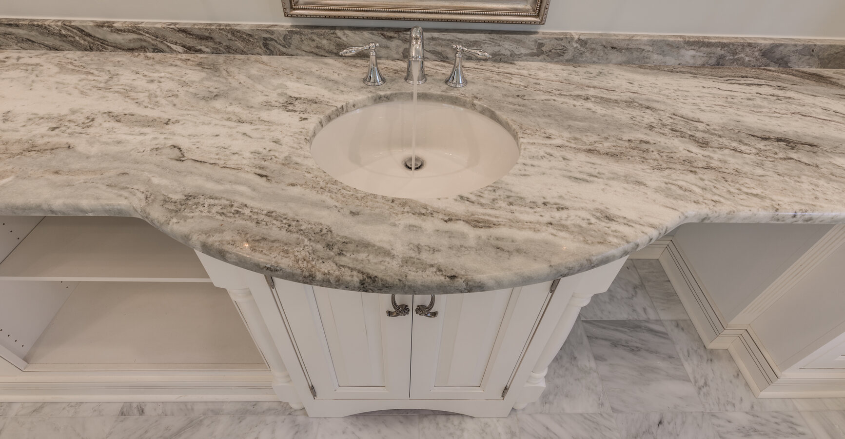 Close-up of marble countertop and under-mount sink in a BeeTree Homes custom bathroom in Jacksonville