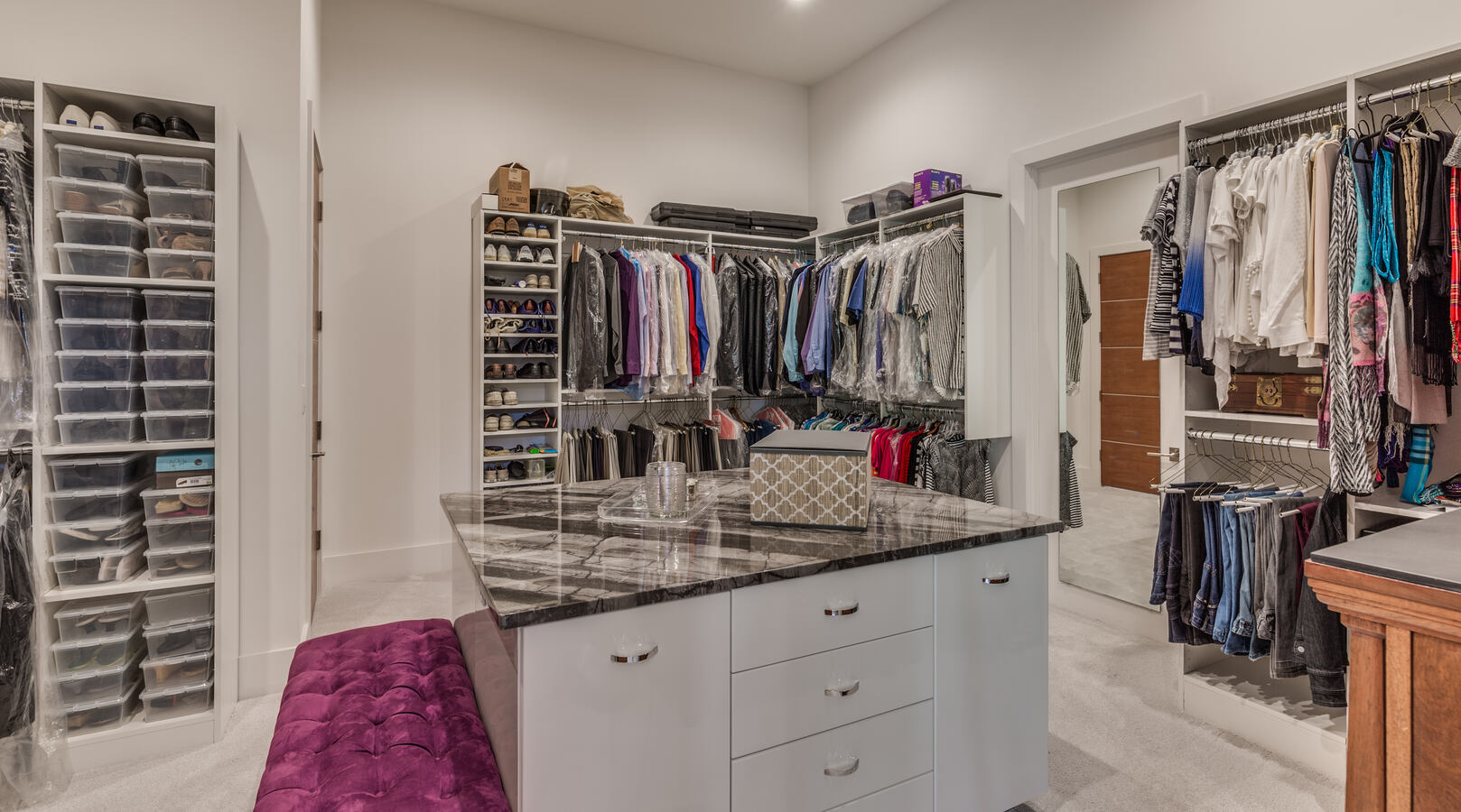 Organized master closet with built-in storage in Jacksonville custom home by BeeTree Homes