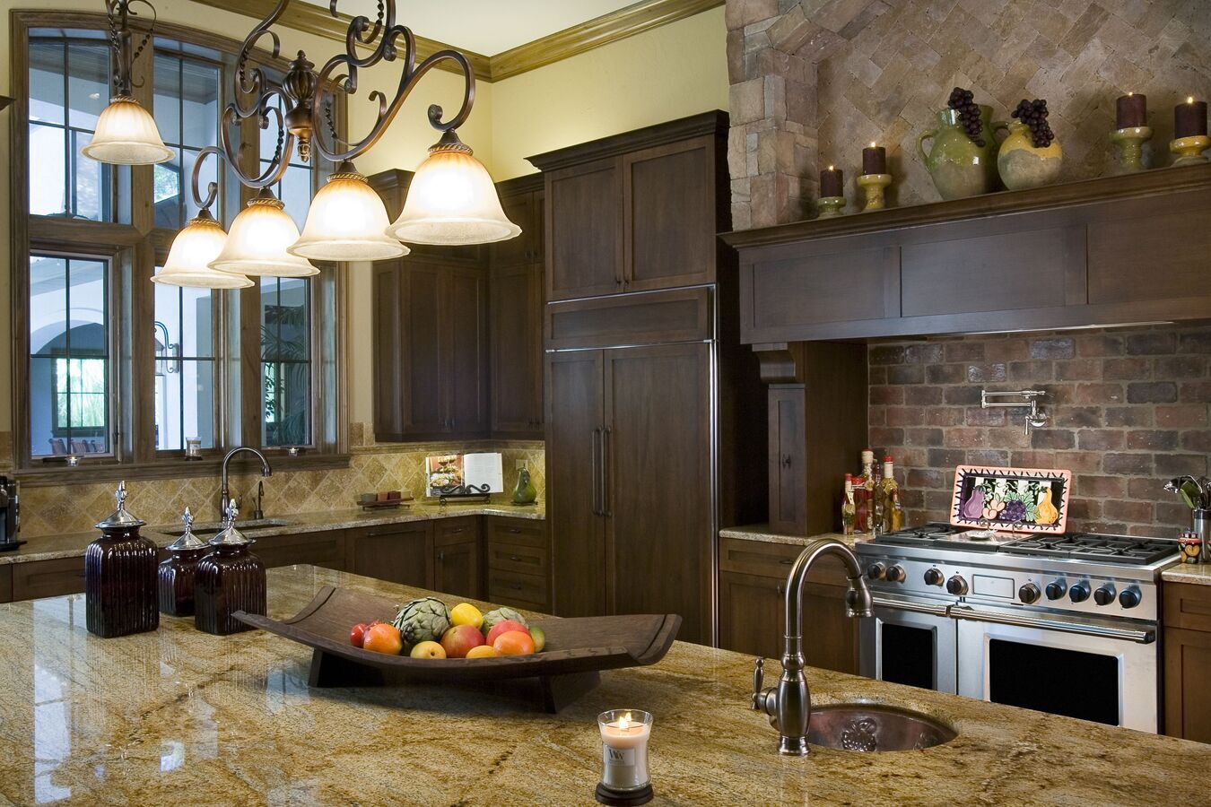 Spacious kitchen with dark wood cabinetry and upscale appliances by BeeTree Homes in Jacksonville