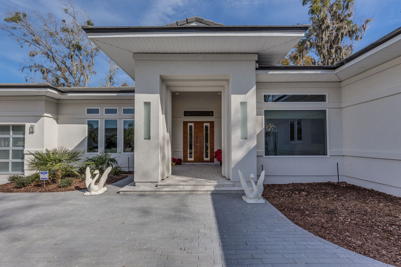 Stylish entryway with architectural columns in BeeTree Homes custom home, Jacksonville