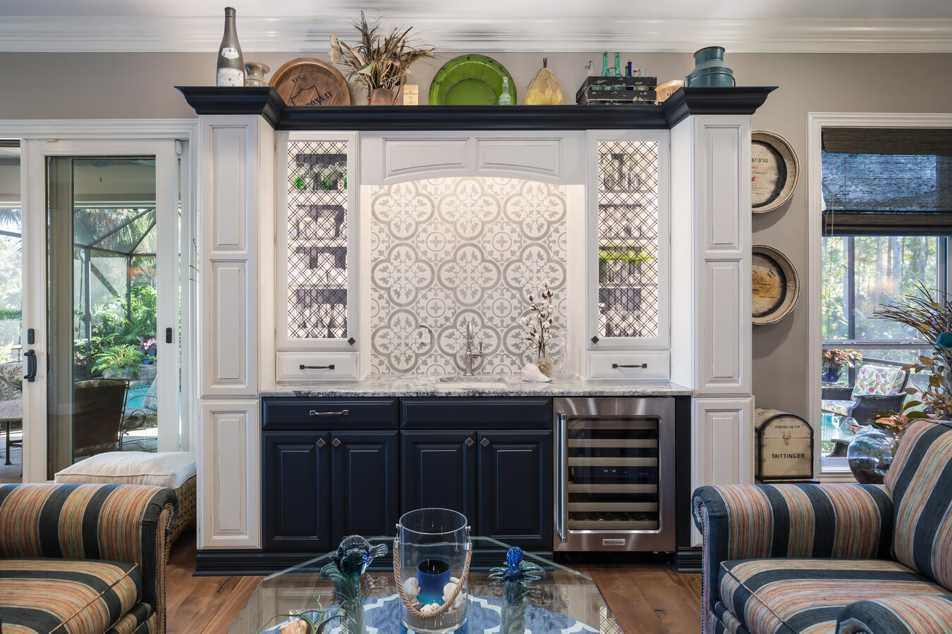 Custom-built bar and beverage station with patterned backsplash in Jacksonville home by BeeTree Homes