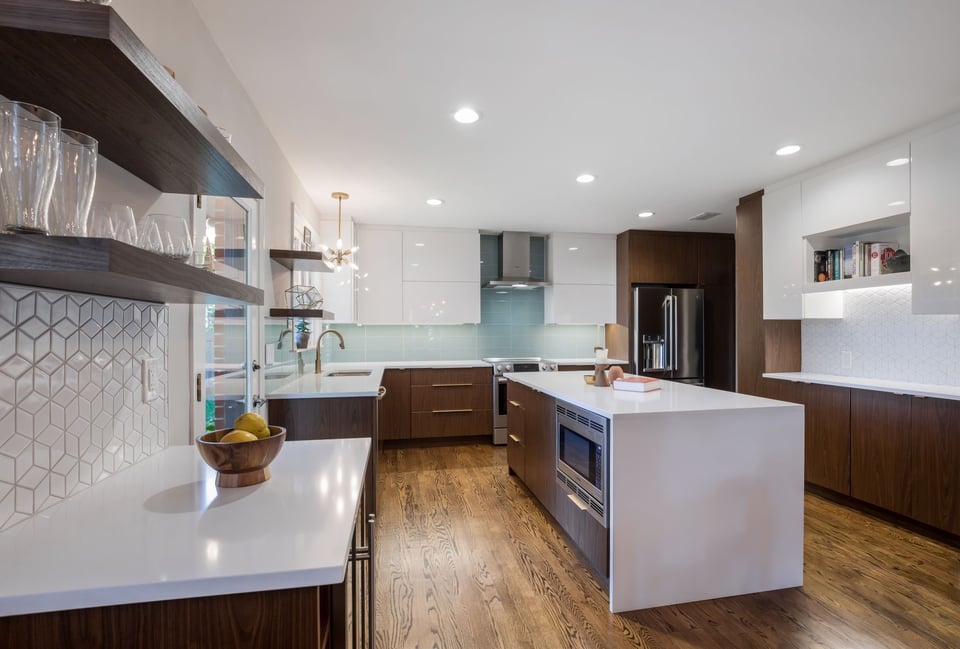 mid century modern kitchen remodel with flat panel cabinets and a small kitchen island in jacksonville, florida