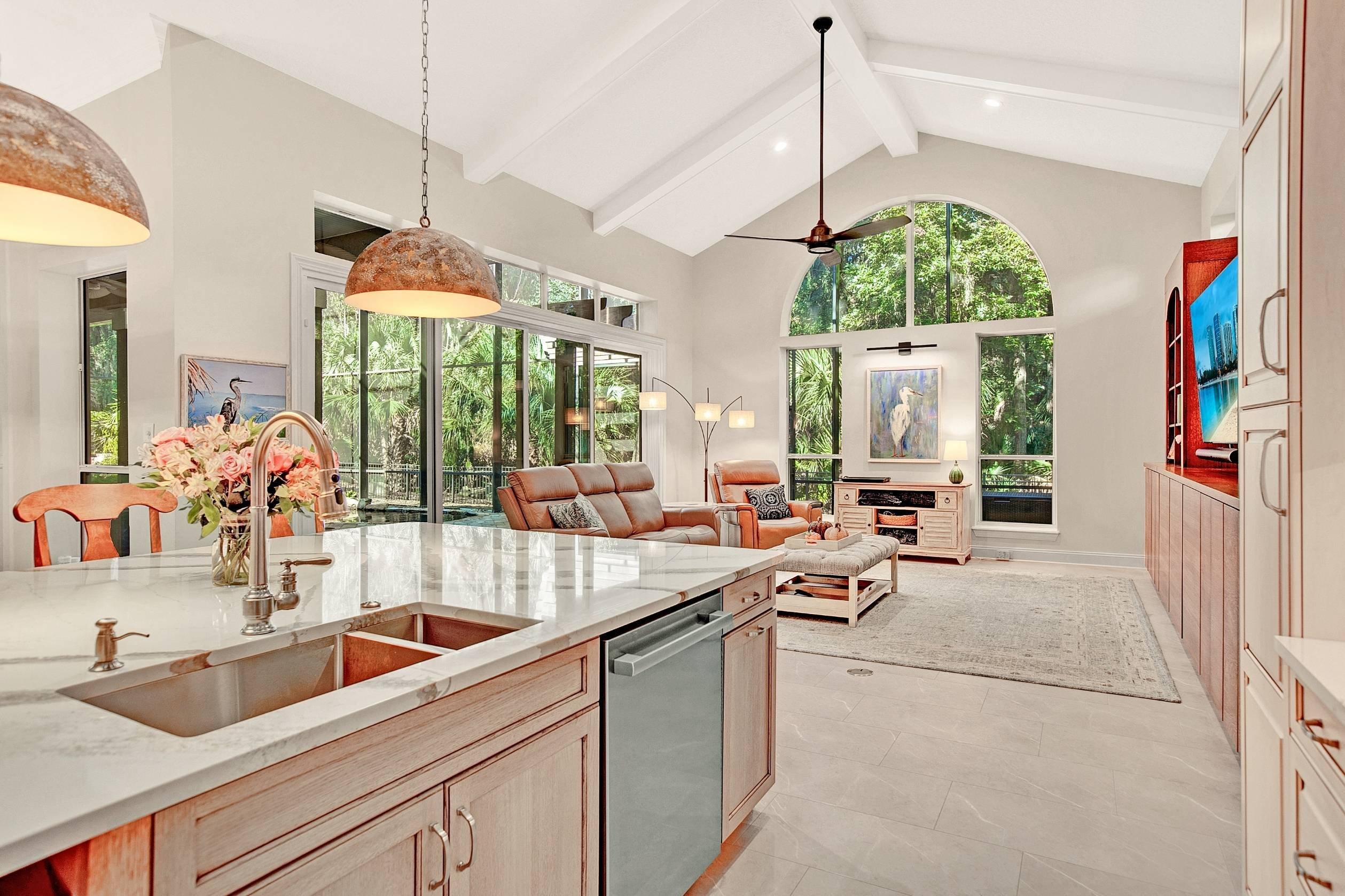 warm neutral open concept kitchen and living room remodel with caulted ceilings in jacksonville, fl