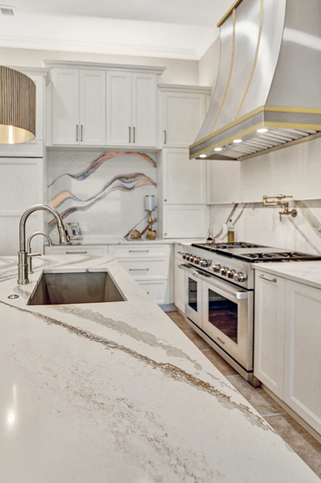 golden contemporary kitchen island sink gold range hood view