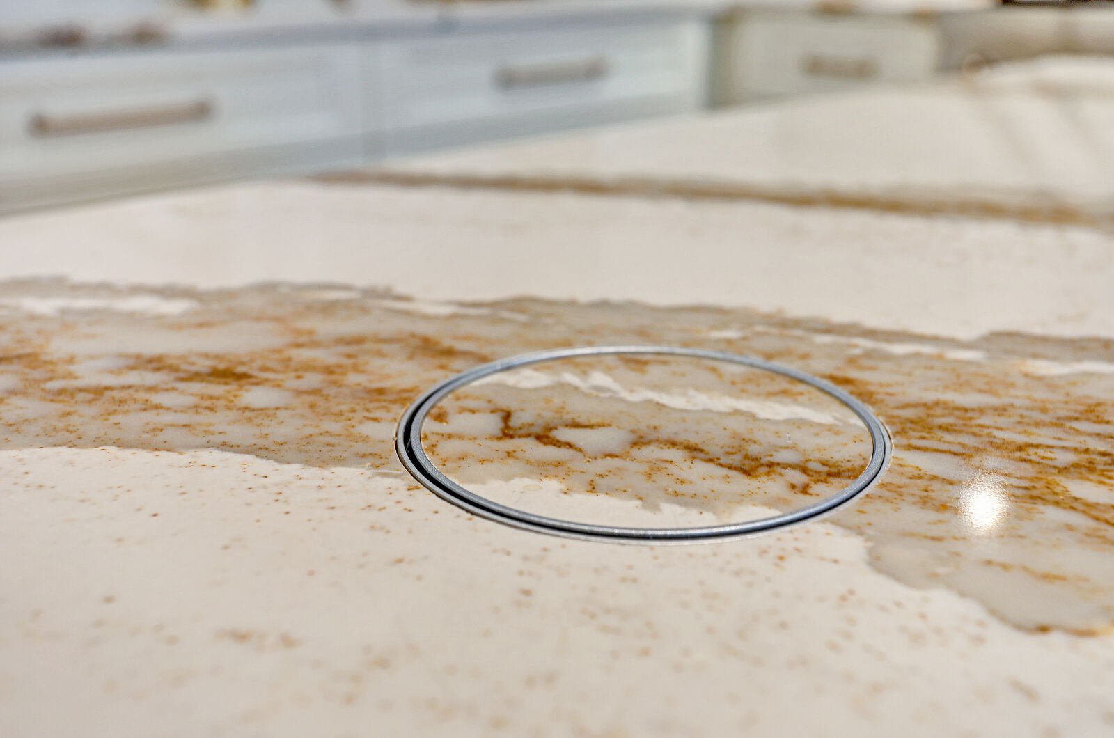 golden contemporary kitchen quartz countertop pop up outlet hole