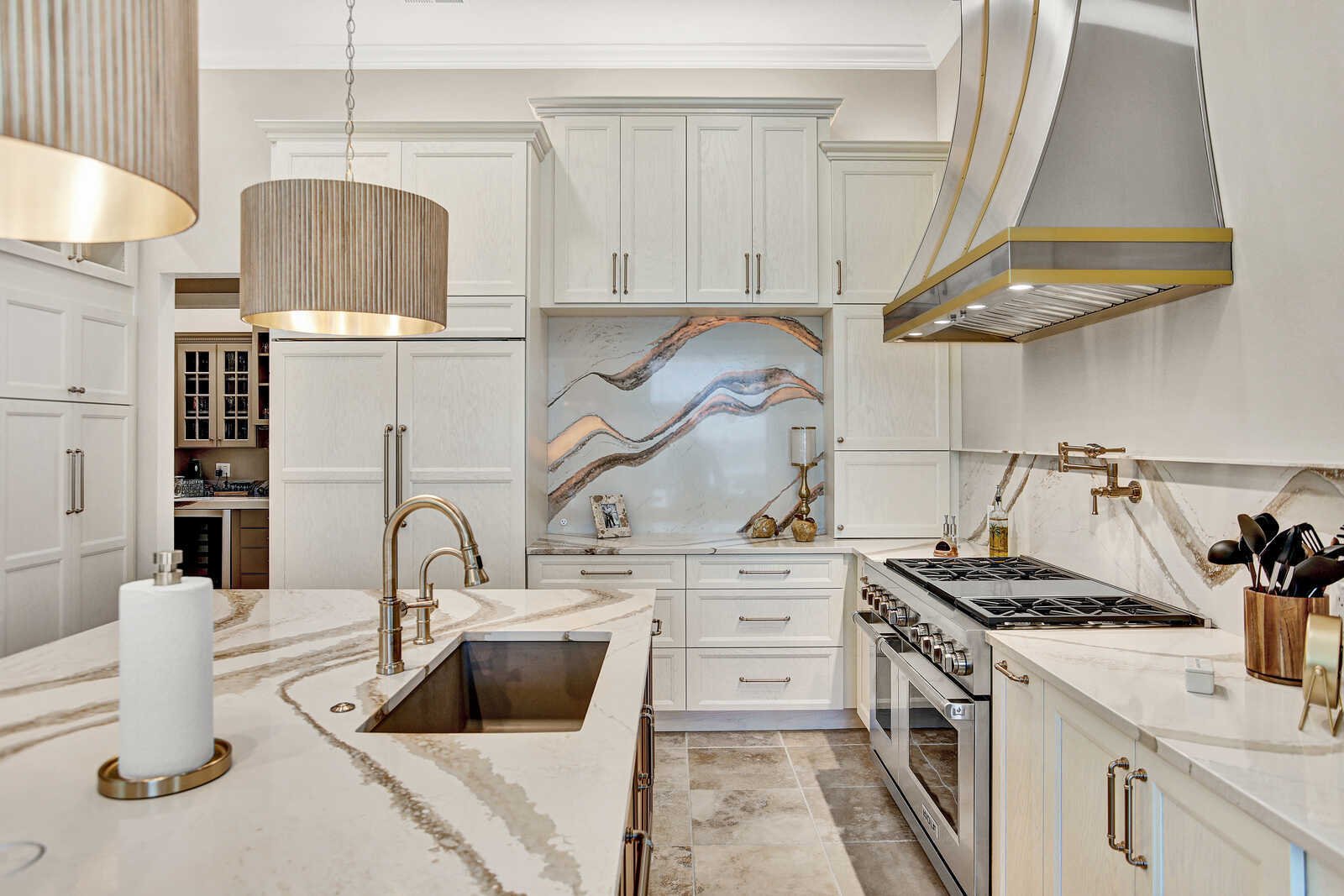 golden contemporary kitchen waterfall island gold range hood