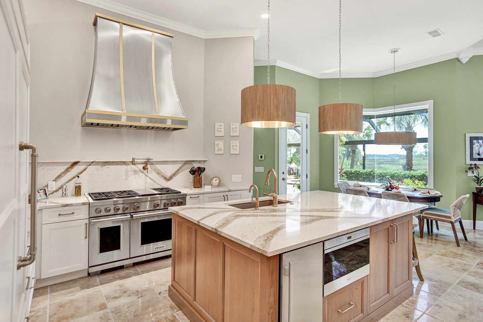 golden contemporary kitchen wolf range green dining nook