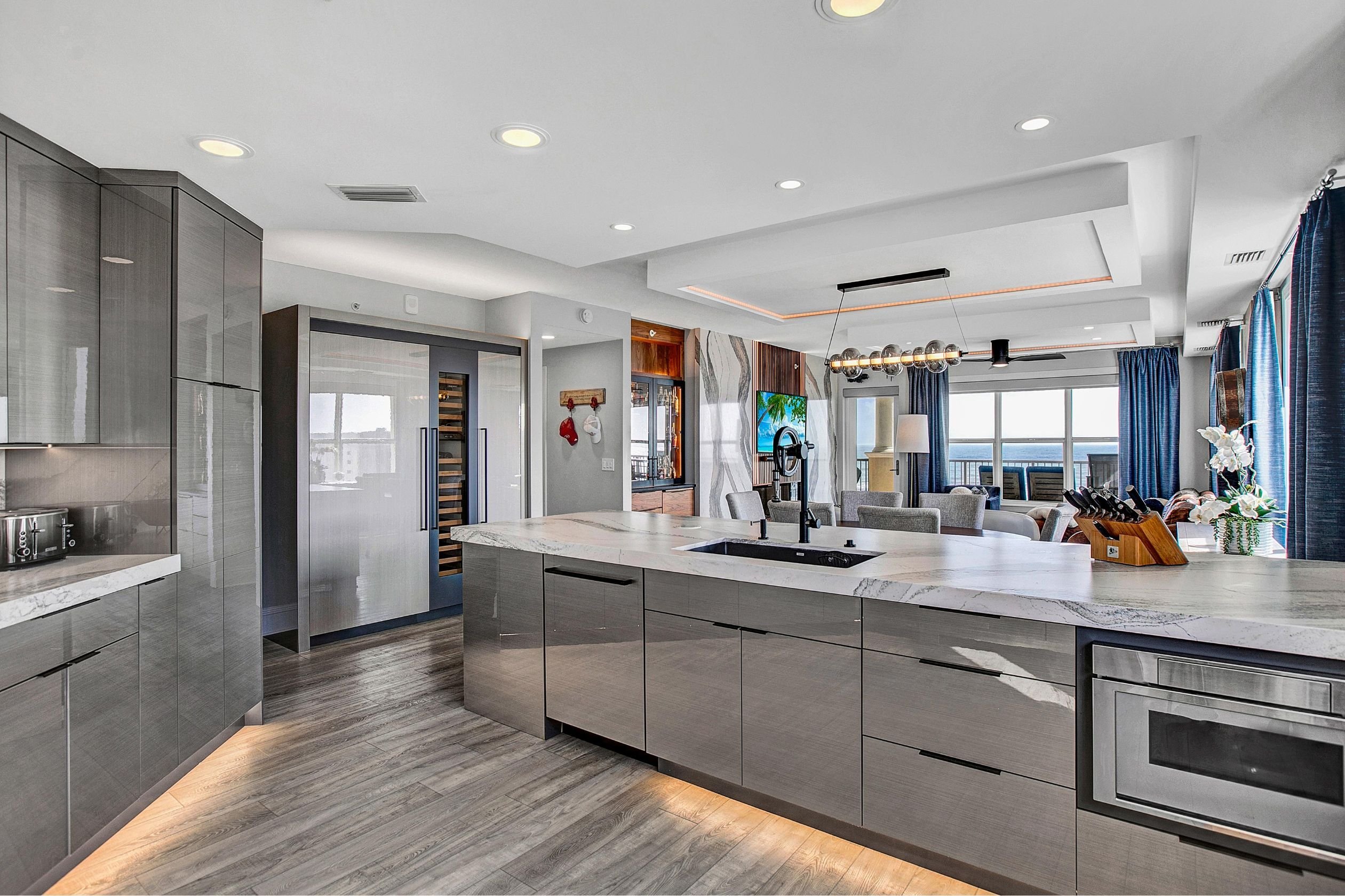 Jax beach kitchen condo remodel with flat panel cabinets and marble counters