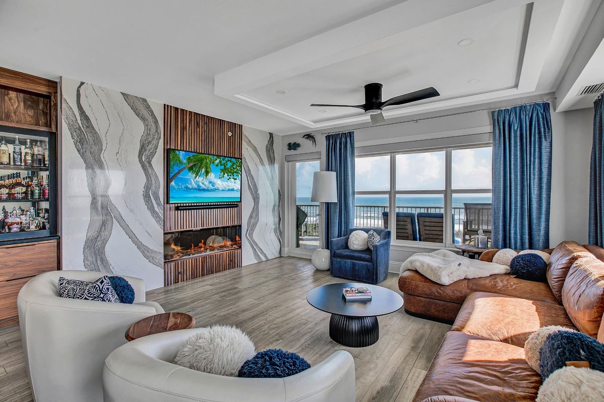 jax beach condo living room remodel with marble slabs and sleek fireplace