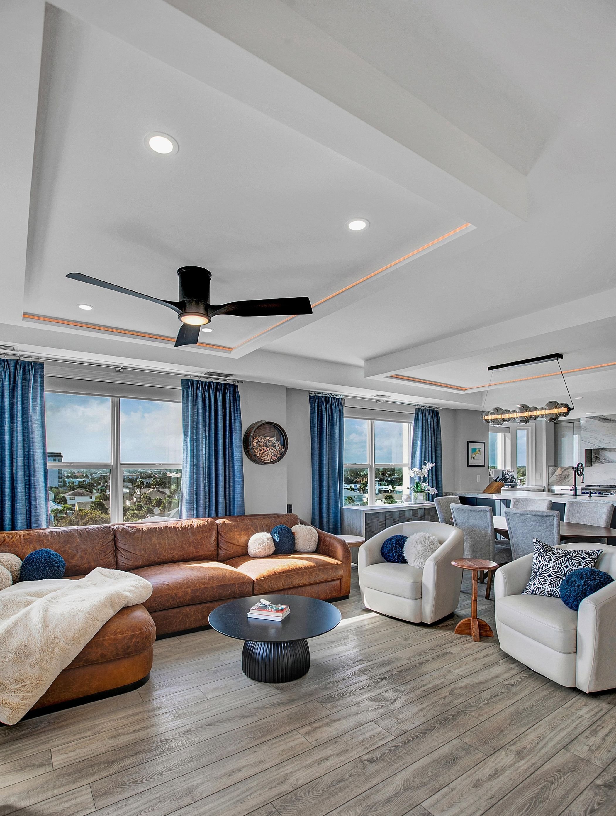seating area with tray ceilings in a jax beach condo renovation