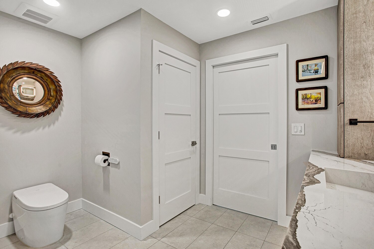clean and simple bathroom layout with sliding doors by BeeTree Homes in Baymeadows FL