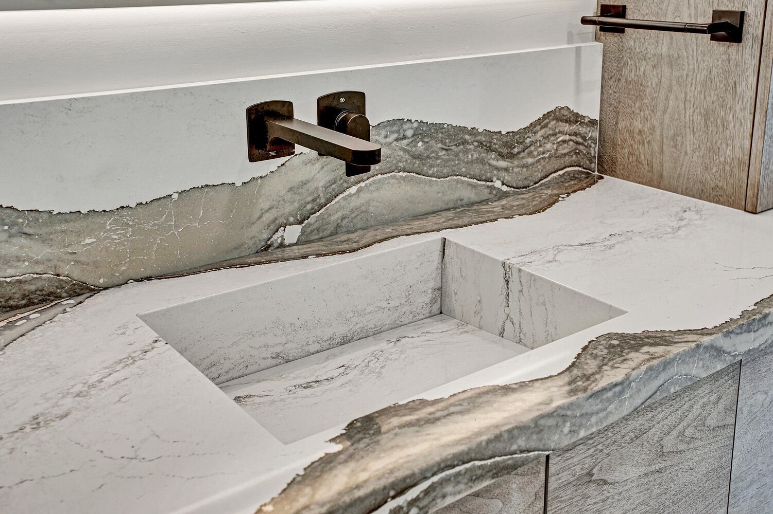 close-up of quartz bathroom countertop and integrated sink in BeeTree Homes Jacksonville FL