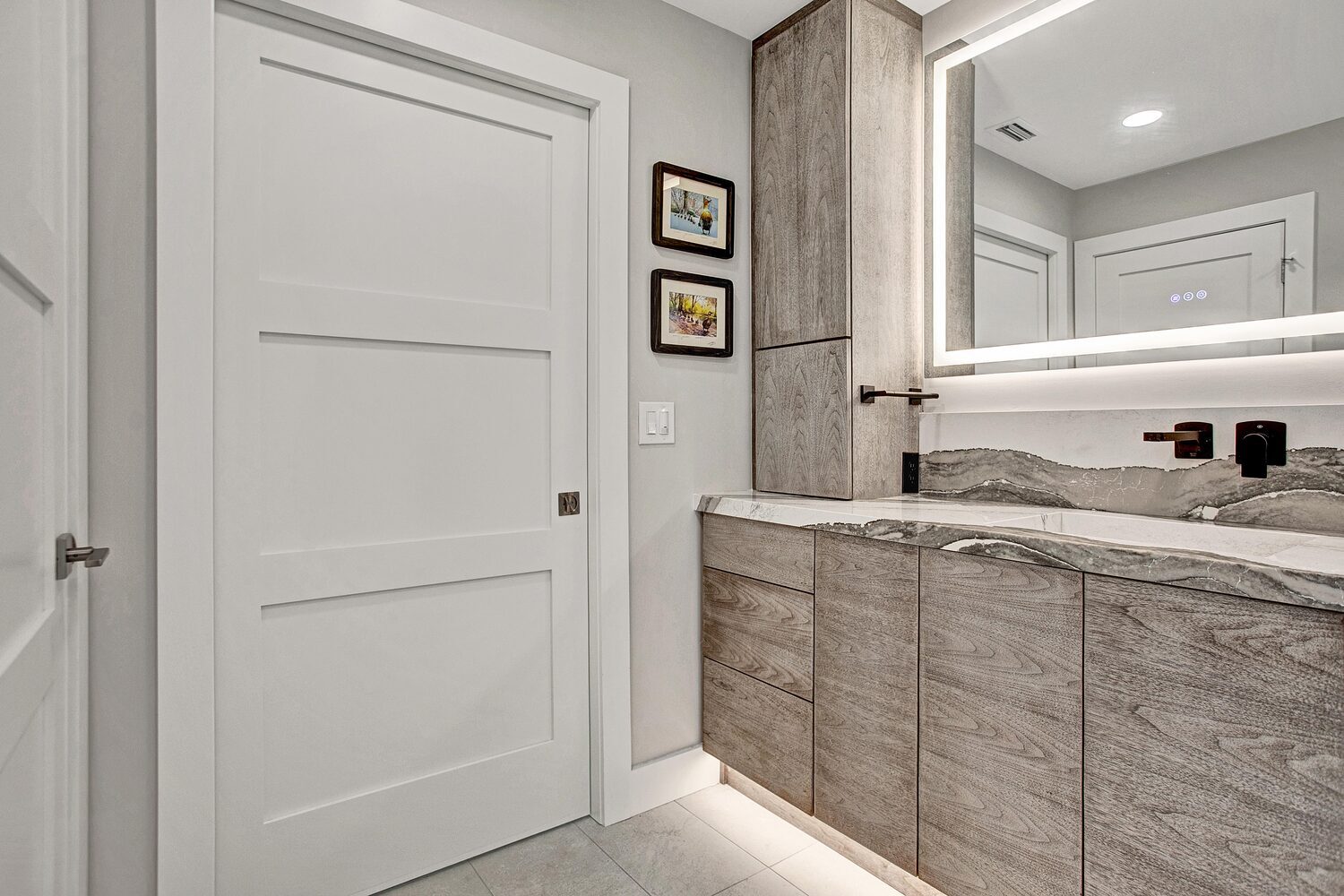 contemporary bathroom vanity with wood cabinets and quartz countertop in BeeTree Homes Jacksonville FL