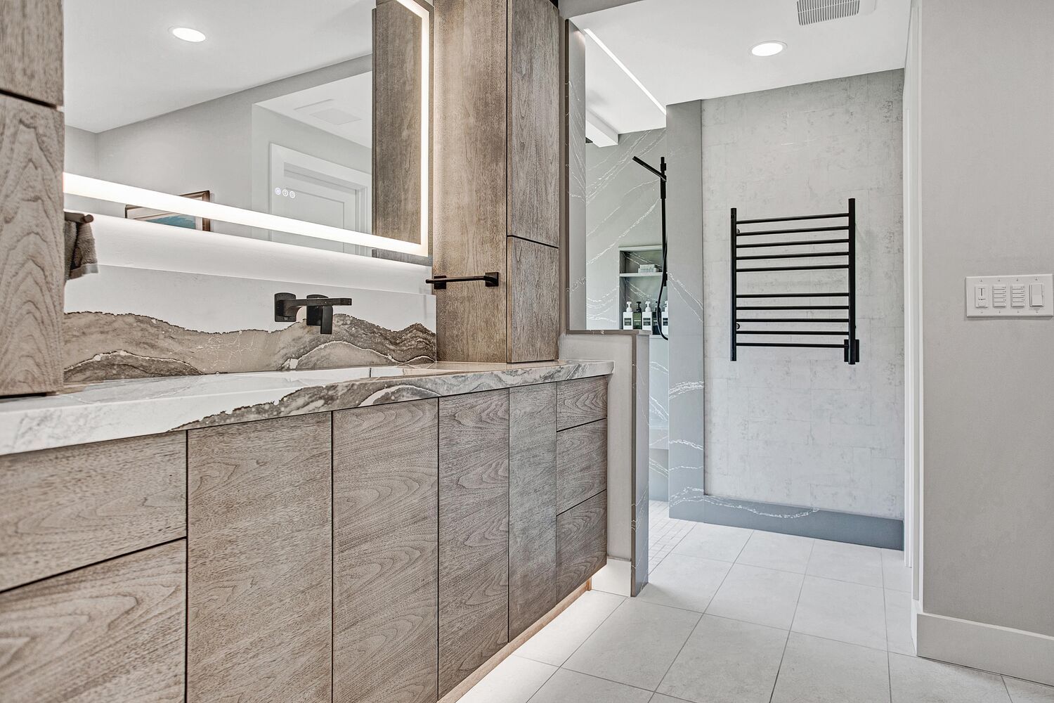 modern bathroom vanity with wood cabinetry and quartz countertop in BeeTree Homes custom home Jacksonville FL
