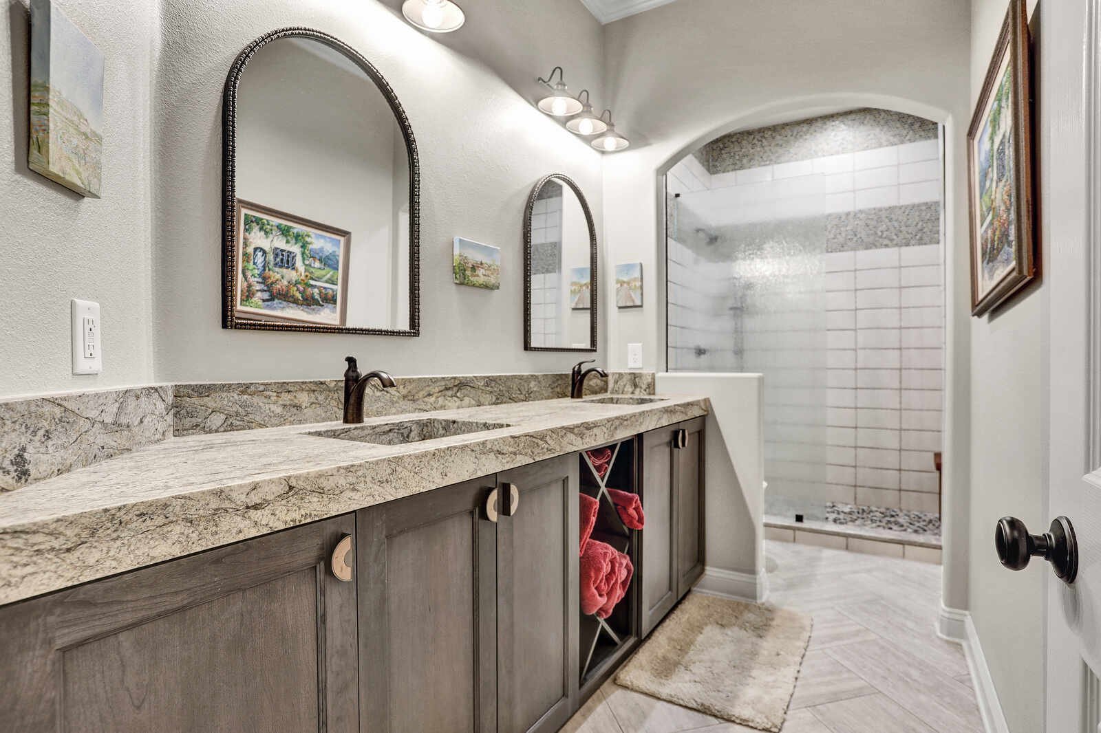 eclectic whole-home remodel bathroom with double vanity and walk-in shower