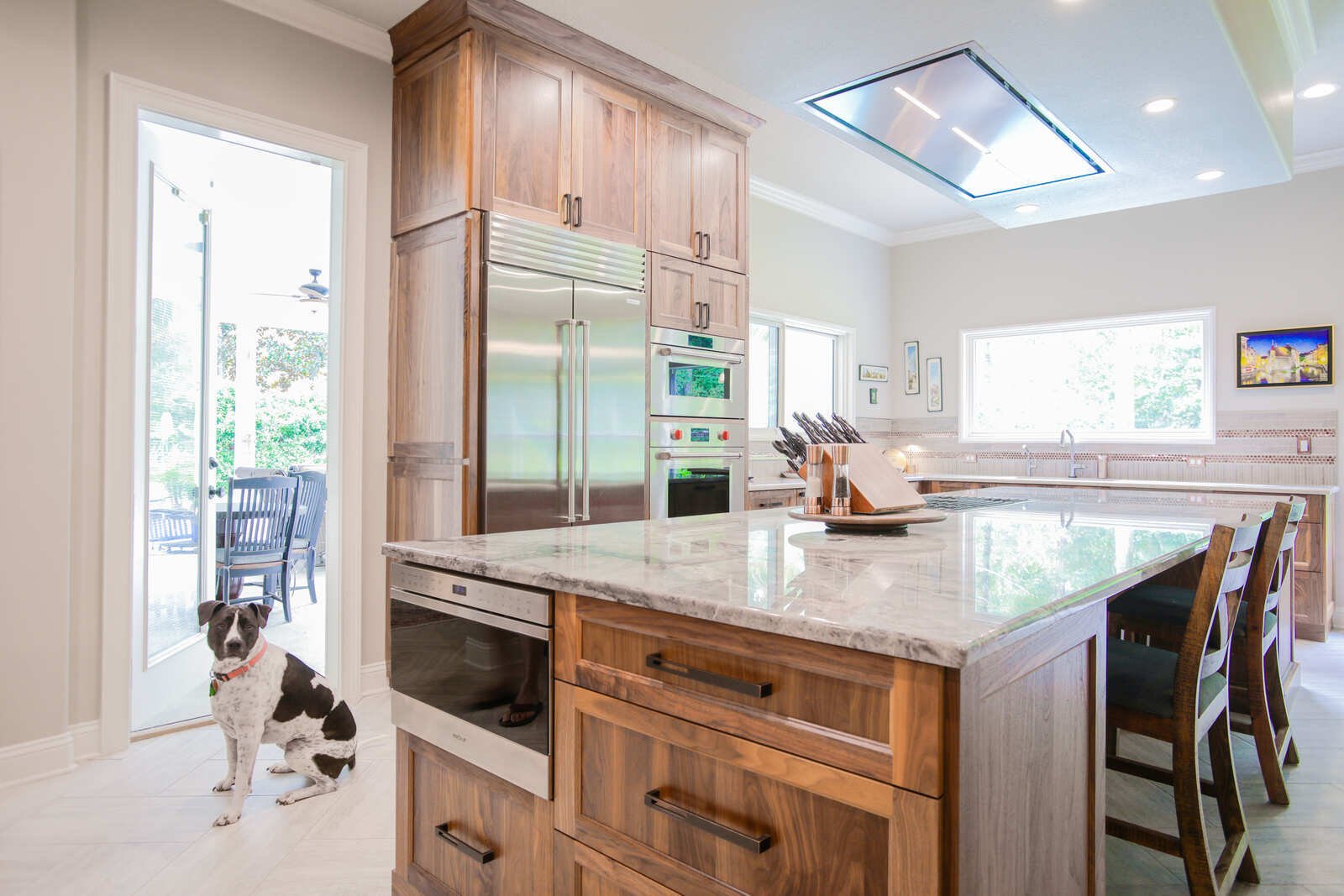 eclectic whole home remodel kitchen island with dog