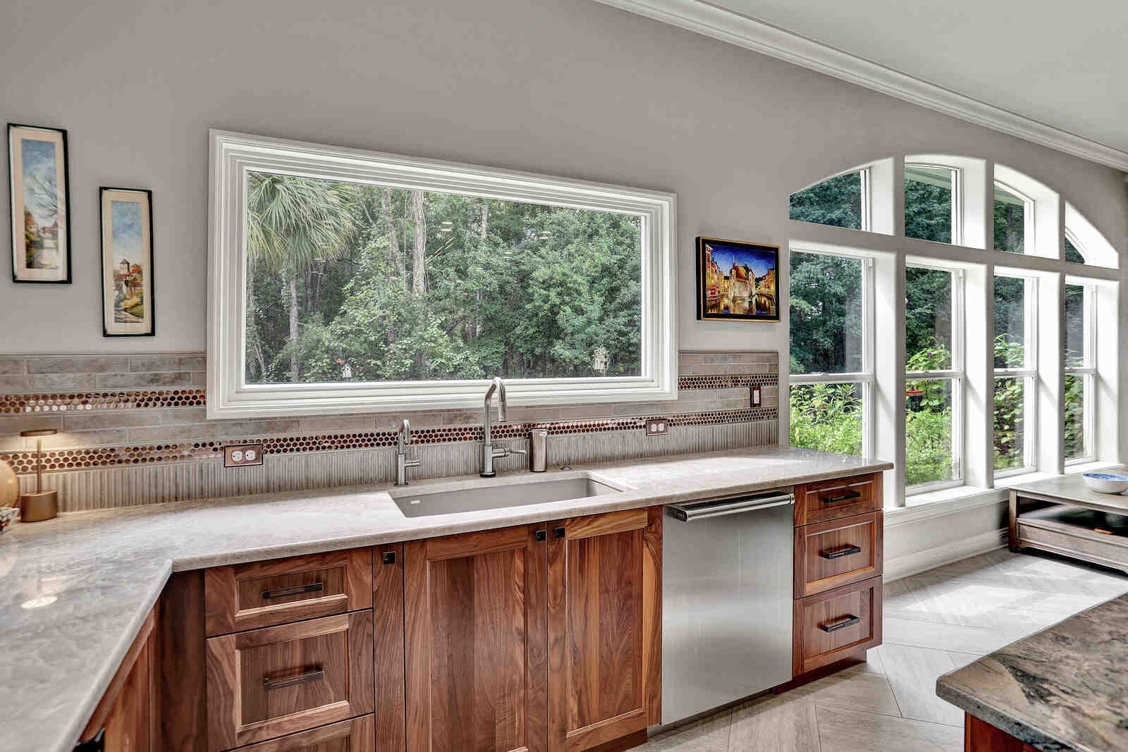 eclectic whole home remodel kitchen sink counter overlooking backyard