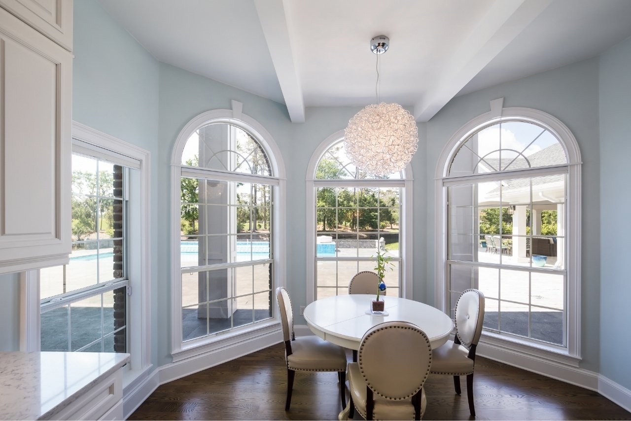 dining area with view of backyard pool and entertainment area (1)