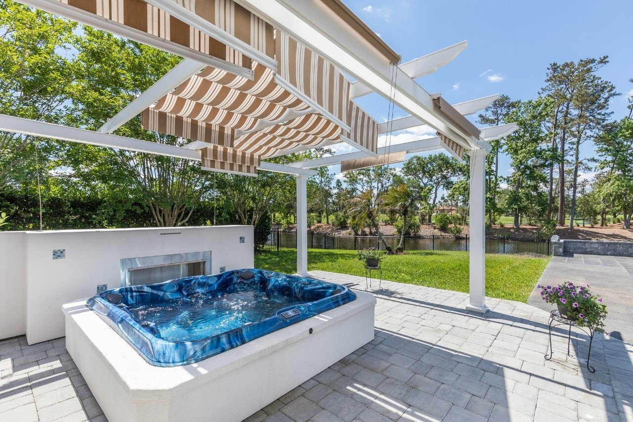 hot tub on a porch covered by a large pergola in florida (1)