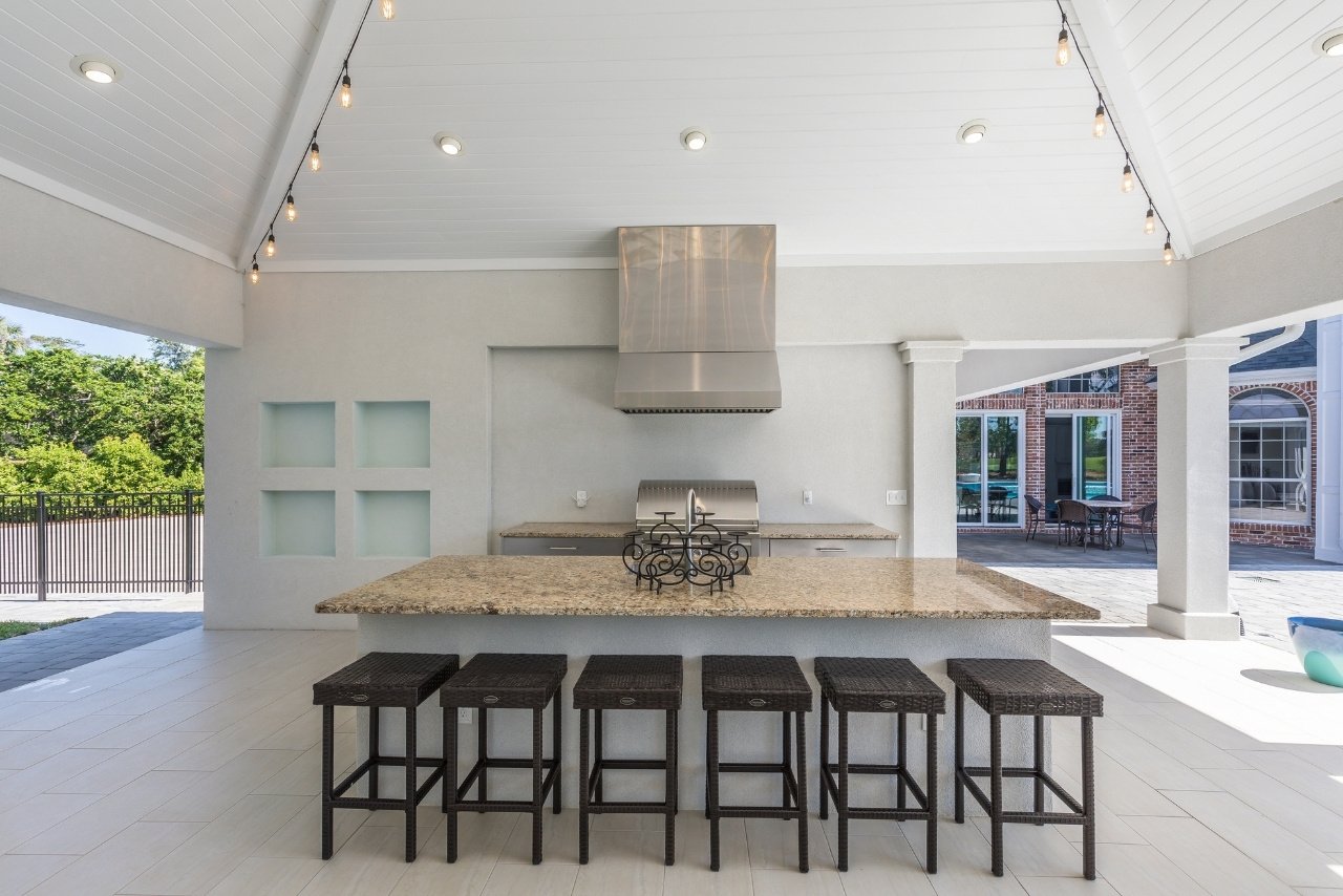 large outdoor kitchen with island bar stool seating for six (1)