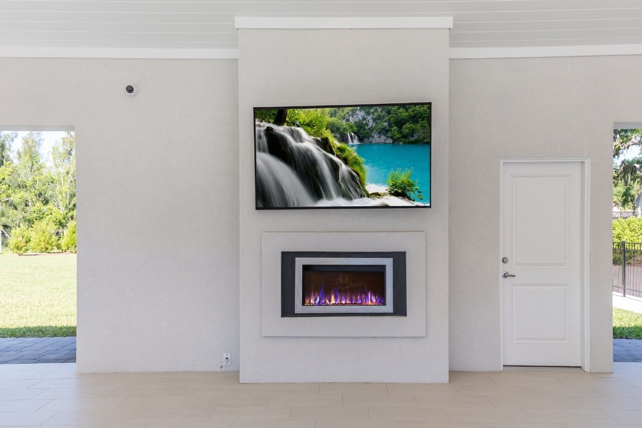 luxury outfoor living with fireplace and television (1)