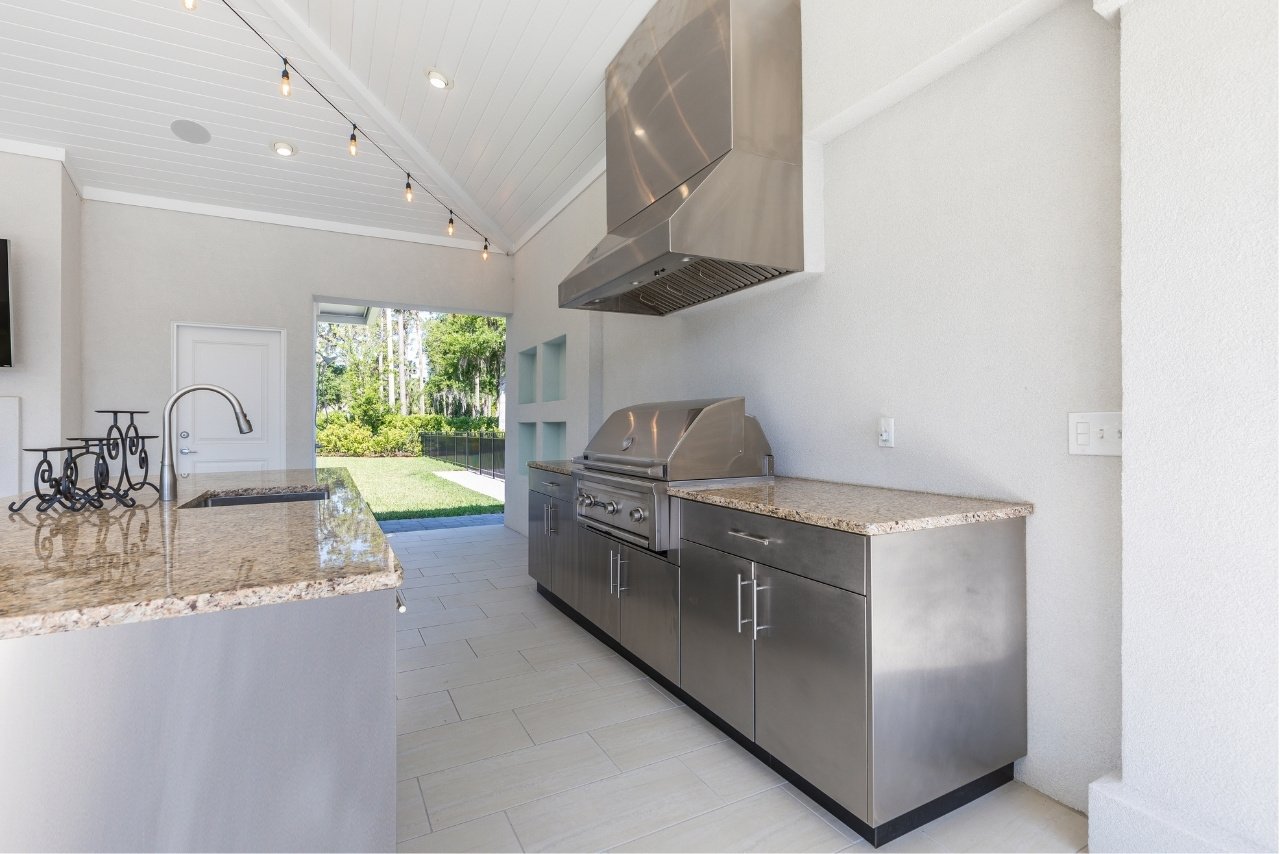 outdoor kitchen home remodel with kitchen island and stainless steel cabinets and grill