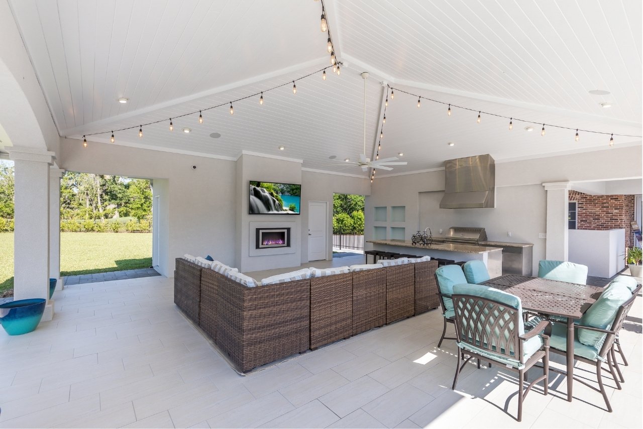 outdoor seating and entertainment area with brown, white, and turquoise color palette (1)