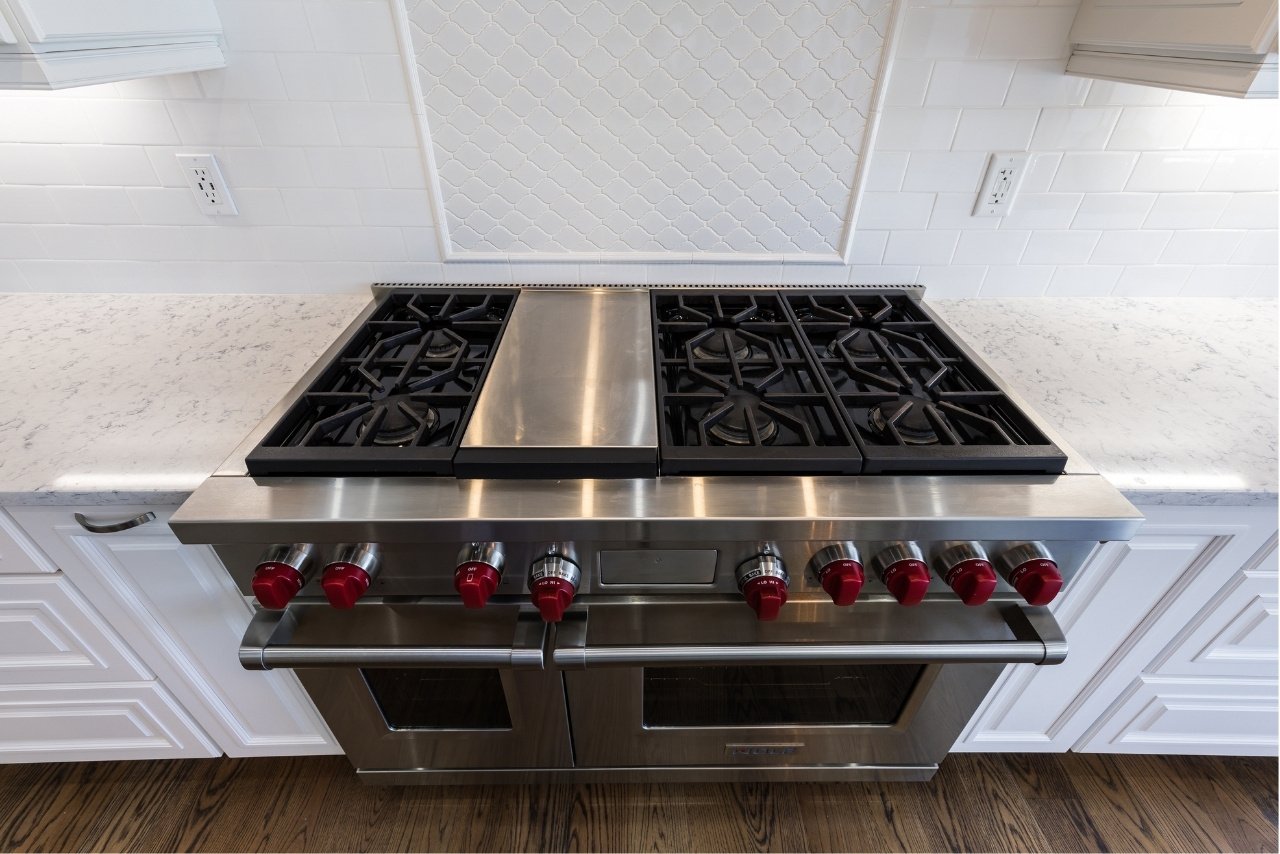 white kitchen remodel with high quality stainless steel oven and stovetop (1)