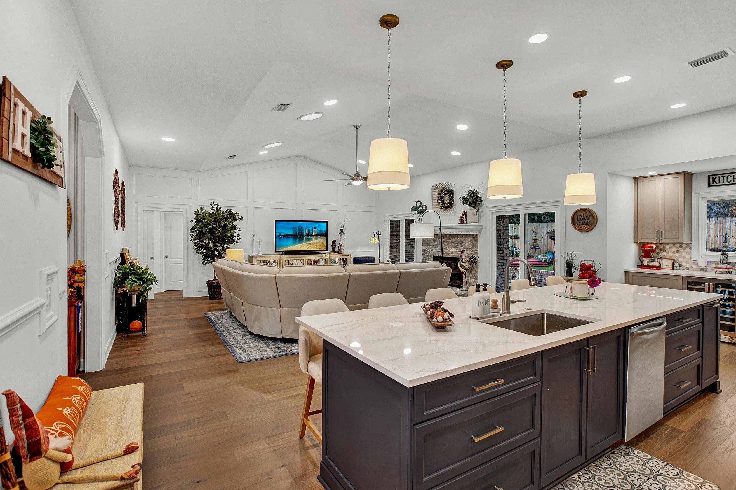 dark kitchen island with light countertops in a jacksonville home renovation