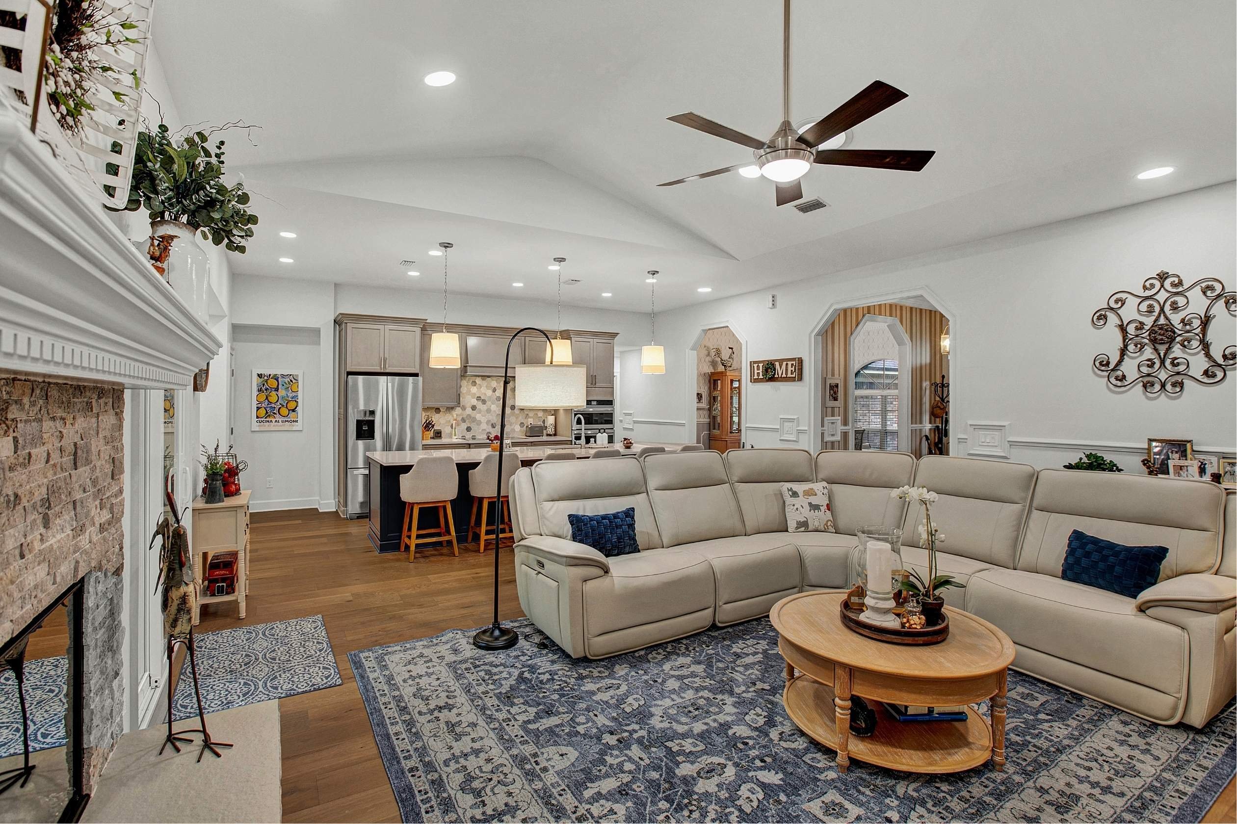 open concept family room and kitchen renovation with neutral tones and blue accents